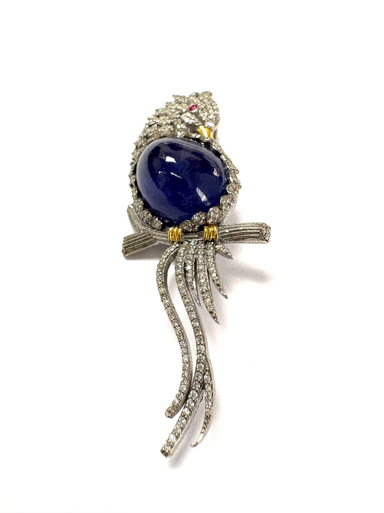 Bird on a branch Pin with diamonds and Tanzanite gemstones