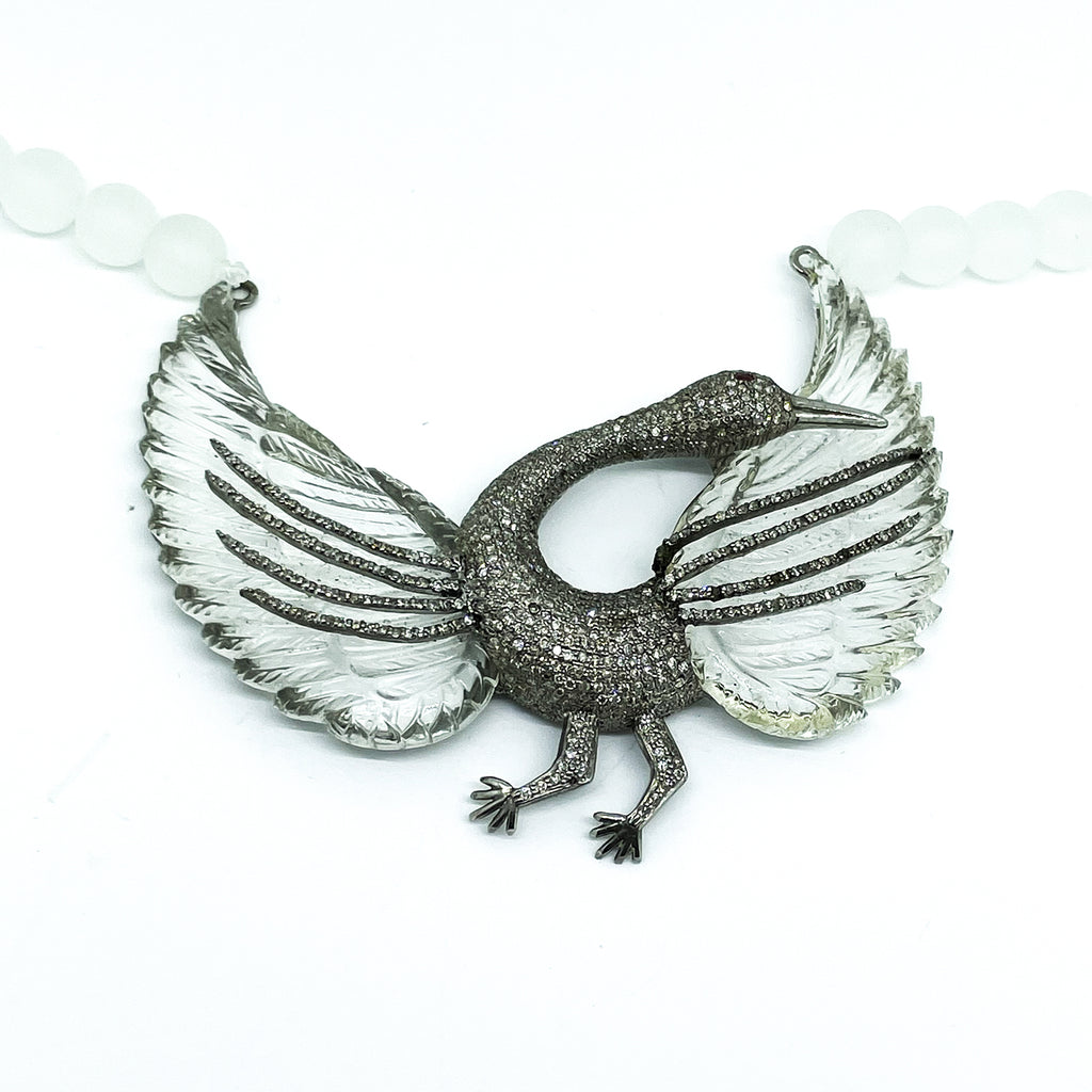 A Unique necklace with a carved crystal Pelican in diamonds