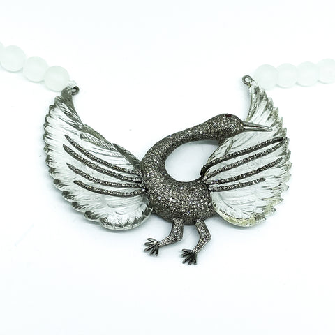 A Unique necklace with a carved crystal Pelican in diamonds